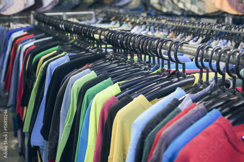 2nd hand sale clothes rack with a selection of fashion for men,filtered image,selective focus