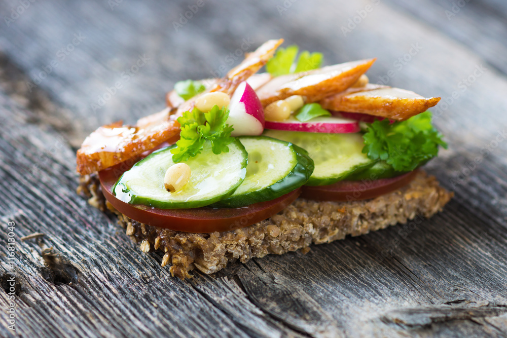 Delicious sandwich with grilled chicken and fresh crunchy vegetables Delicious sandwich with grilled chicken and fresh crunchy vegetables