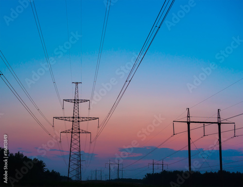 The silhouette of the evening electricity transmission pylon © yelantsevv