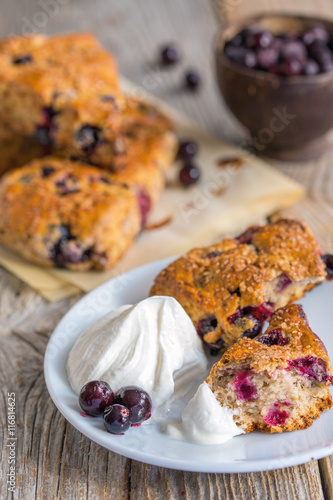 Homemade scones with berries and cream.
