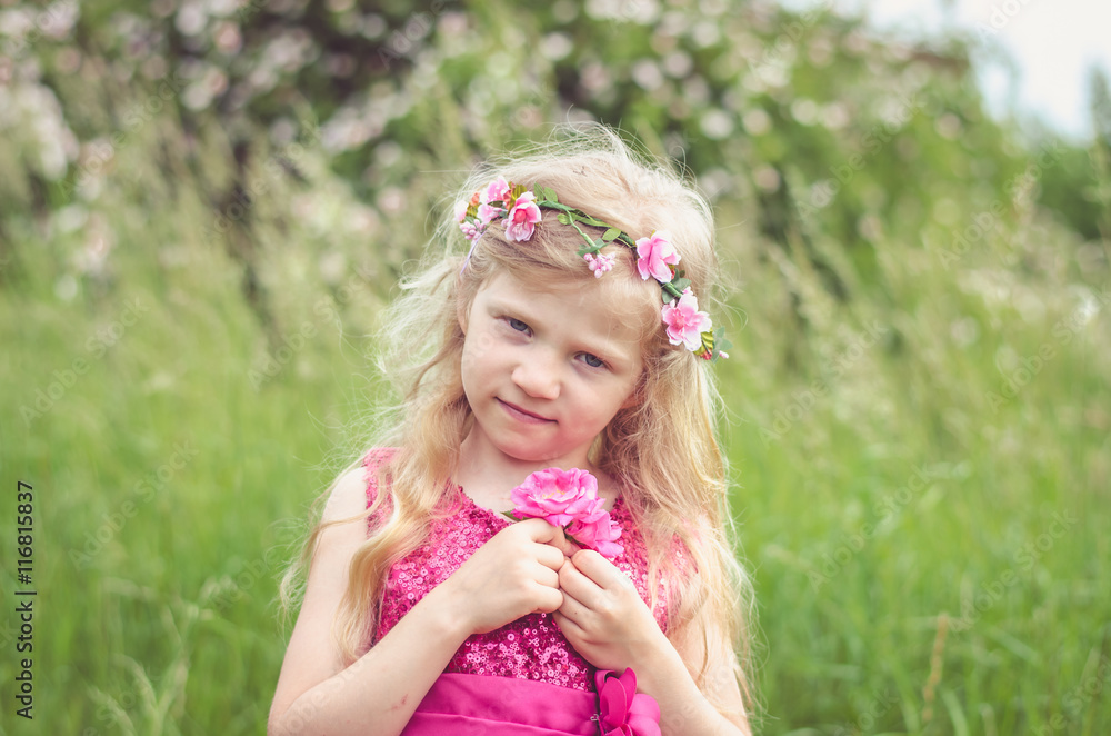 little blond girl with pink rose flowers little blond girl with pink rose flowers