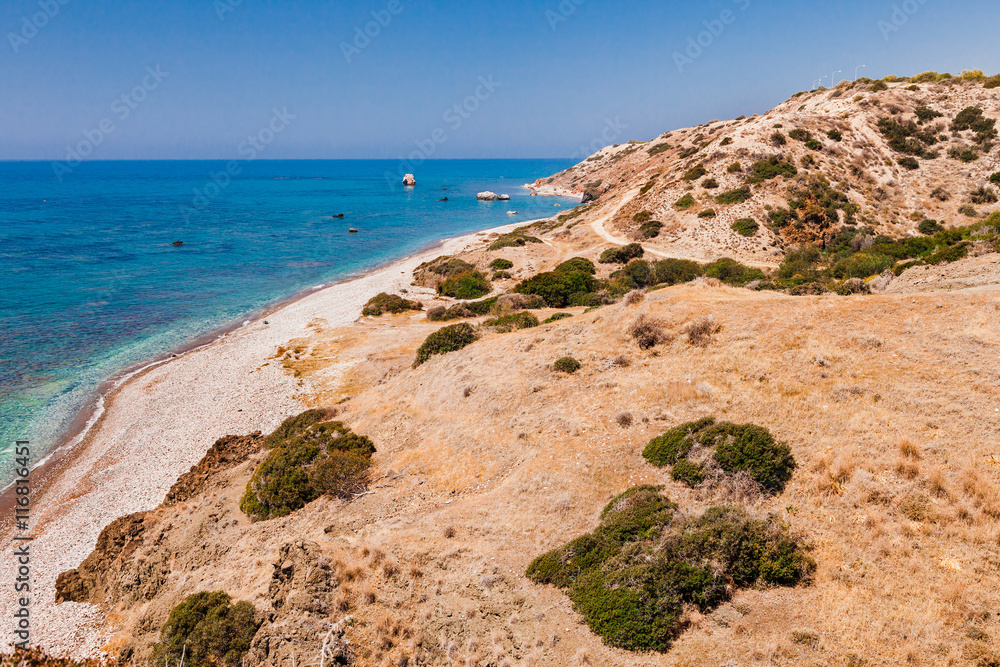 Panoramic landscape Petra tou Romiou (The rock of the Greek), Aphrodite's legendary birthplace in Paphos, Cyprus island, Mediterranean Sea. Amazing blue green sea and sunny day.