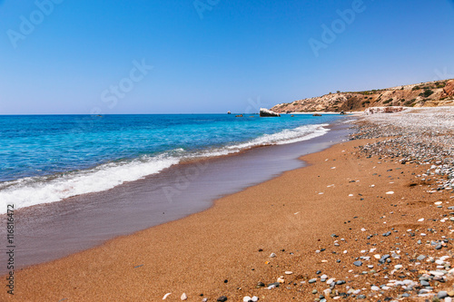 Beautiful beach on Petra tou Romiou  The rock of the Greek   Aphrodite s legendary birthplace in Paphos  Cyprus island  Mediterranean Sea. Amazing blue green sea and sunny day.