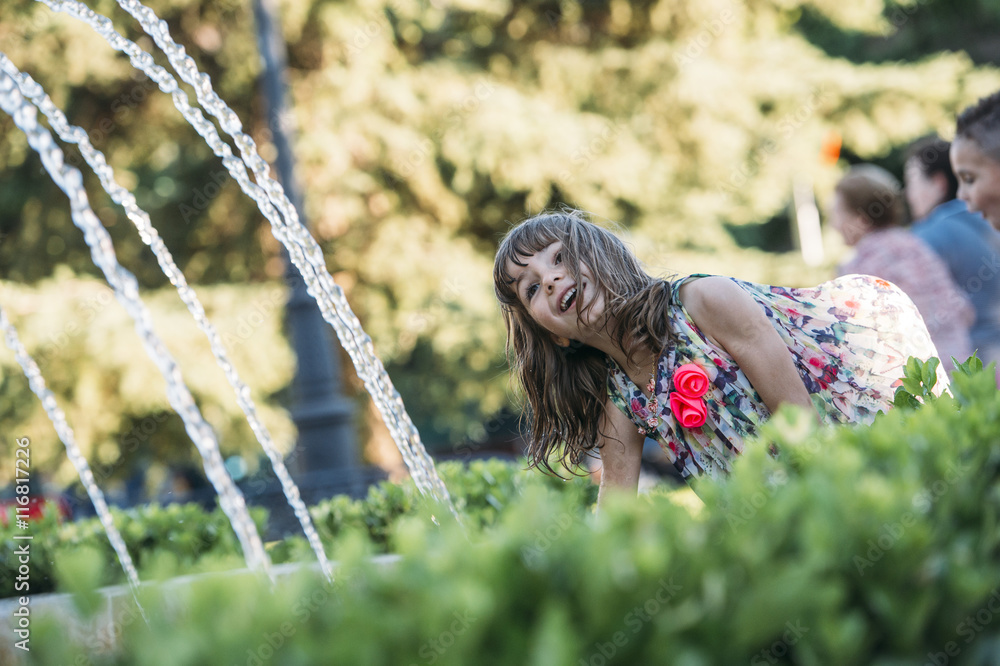 happy child playing in a fountain happy child playing in a fountain
