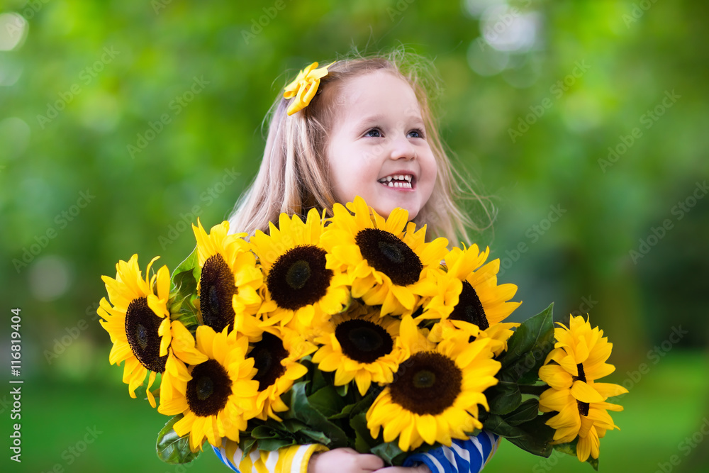Little girl with sunflowers Little girl with sunflowers