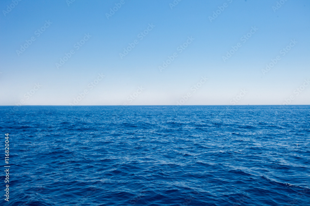 Fototapeta premium Background of sparkling sea water on a bright sunny day. Sea and sky