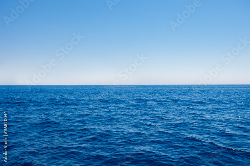 Background of sparkling sea water on a bright sunny day. Sea and sky © nikodash
