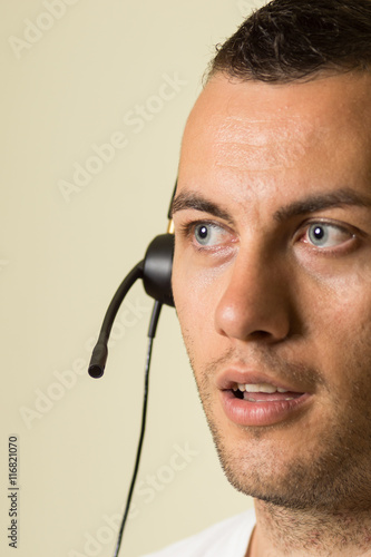 Male call center worker with headset.