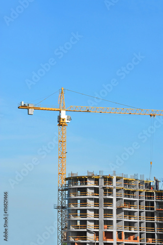 Crane and highrise construction site