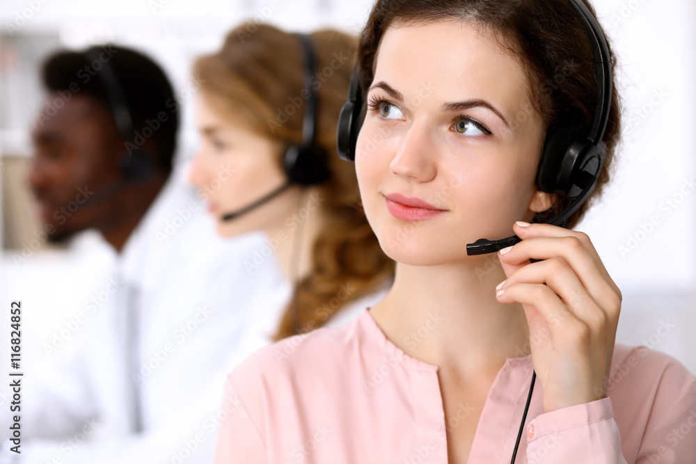 Call center operator.Young beautiful business woman in headset. Call center operator.Young beautiful business woman in headset.