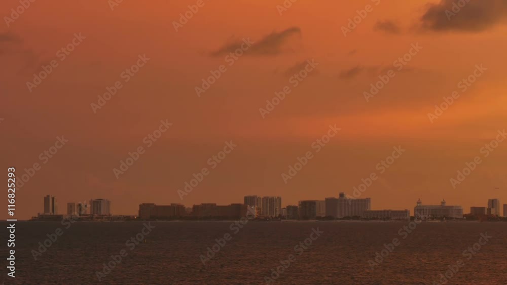 sunset over cancun city skyline cityscape as seen from the sea sunset over cancun city skyline cityscape as seen from the sea