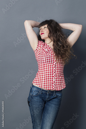 young woman with long curly brown hair for proud femininity
