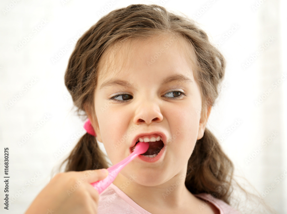 Cute girl with toothbrush isolated on white Cute girl with toothbrush isolated on white