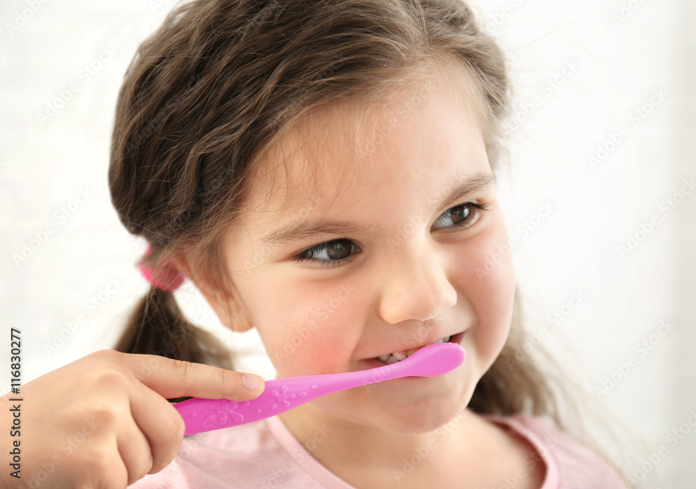Cute girl with toothbrush isolated on white Cute girl with toothbrush isolated on white