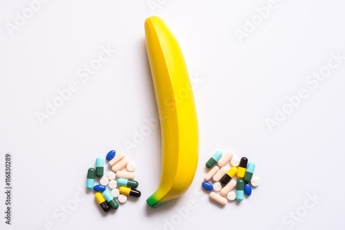 Banana with pill for impotence man photo