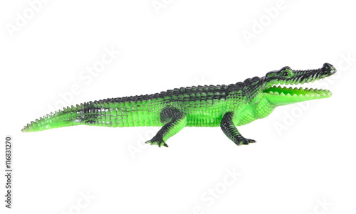 Plastic crocodile toy crawling isolated on white background.Plas