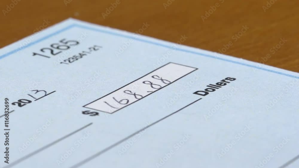 Macro shot of a check being filled out. Macro shot of a check being filled out.