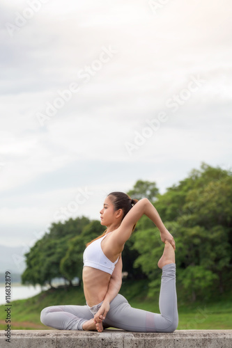 Asia woman doing yoga fitness exercise