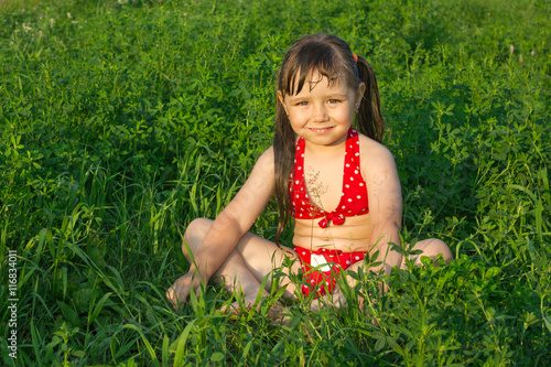 little white girl children sit on grass