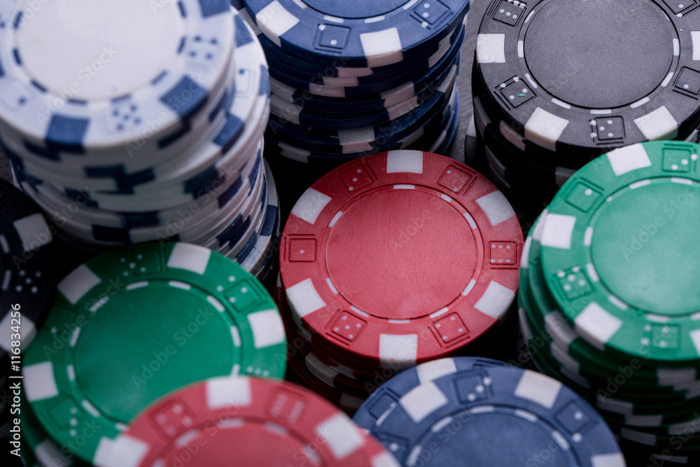 Casino poker chips and playing card with black background Casino poker chips and playing card with black background