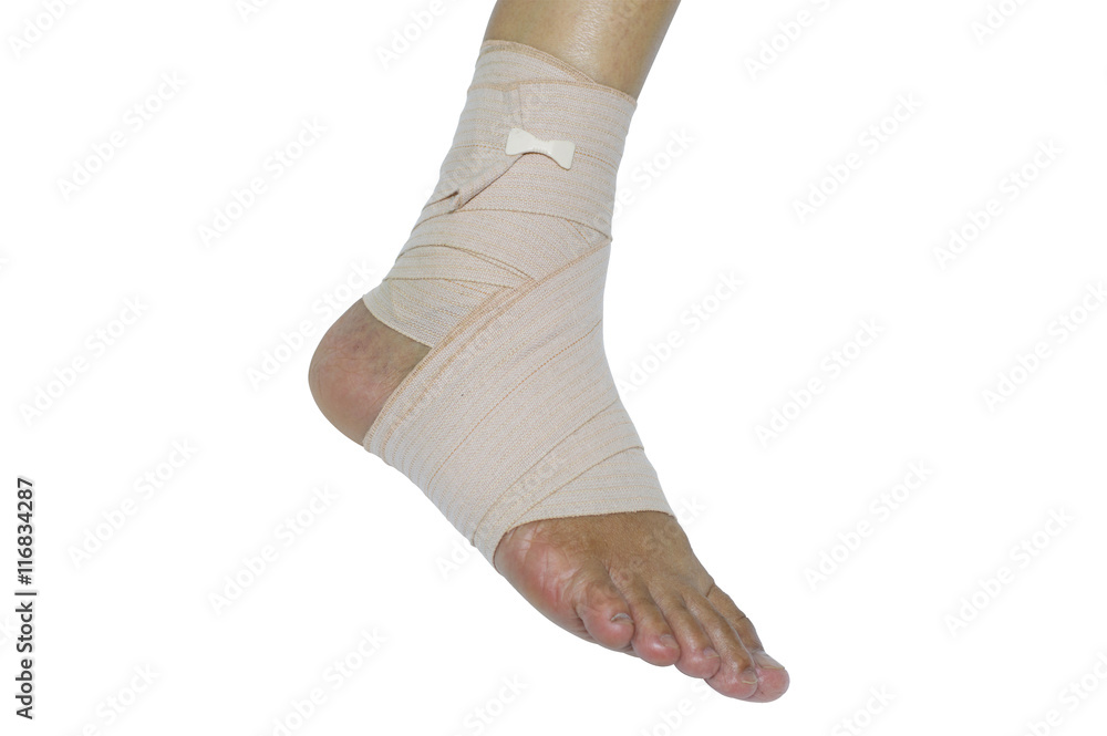 Foot injury, Bandaged foot on a white background Foot injury, Bandaged foot on a white background