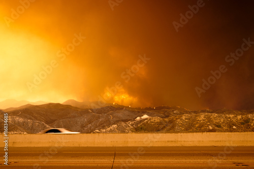 Wildfire in the mountains near freeway