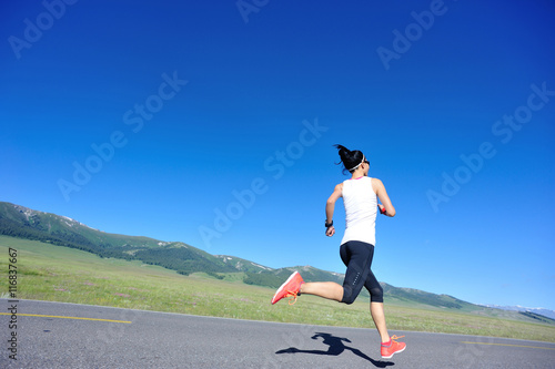healthy lifestyle young fitness woman runner running on mountain trail