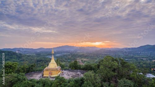 Big Buddha statue and golden pagoda on hilltop this temple have several amazing building and famous in thailand.this temple is beside national park. the middle part of Thailand