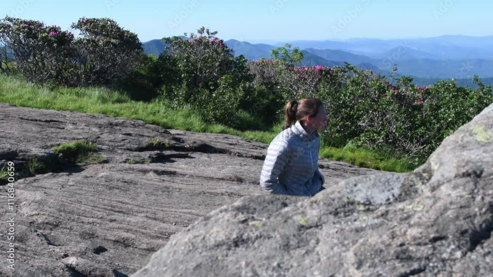 4K Slider Right Woman Behind Large Rock at overlook in mountains 4K Slider Right Woman Behind Large Rock at overlook in mountains