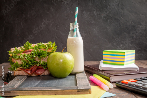 Fototapeta Naklejka Na Ścianę i Meble -  School lunch with sandwich, milk and apple 