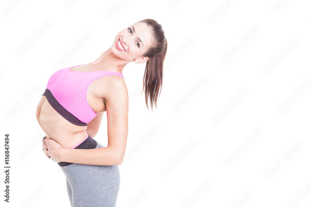 Young woman contortionist posing in unnatural position Young woman contortionist posing in unnatural position