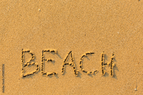 Beach - word drawn on the sand.