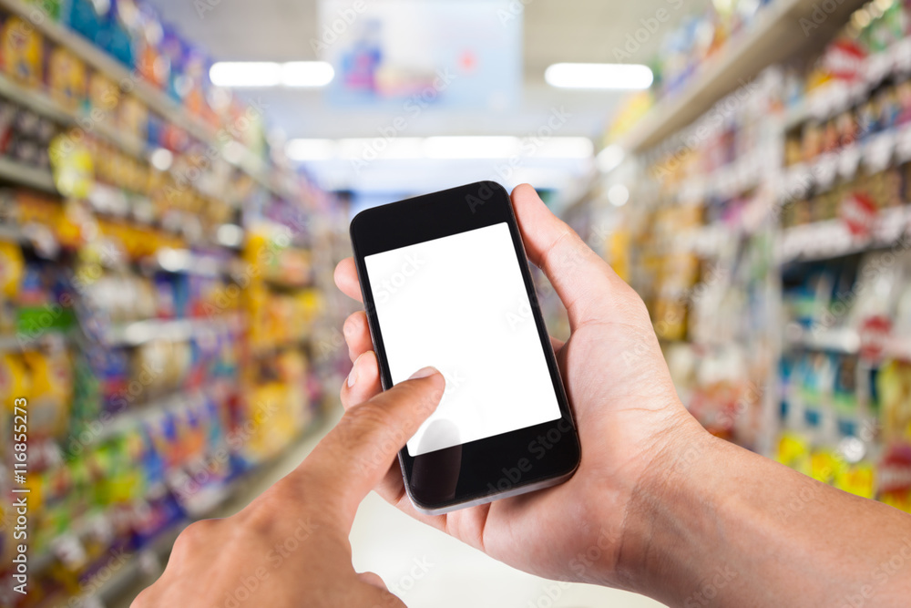 Person using smartphone white screen holder on hand with shelves Person using smartphone white screen holder on hand with shelves