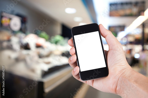 Person using smartphone white screen holder on hand with market