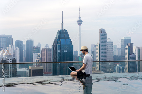 Businessman in an infinity pool photo