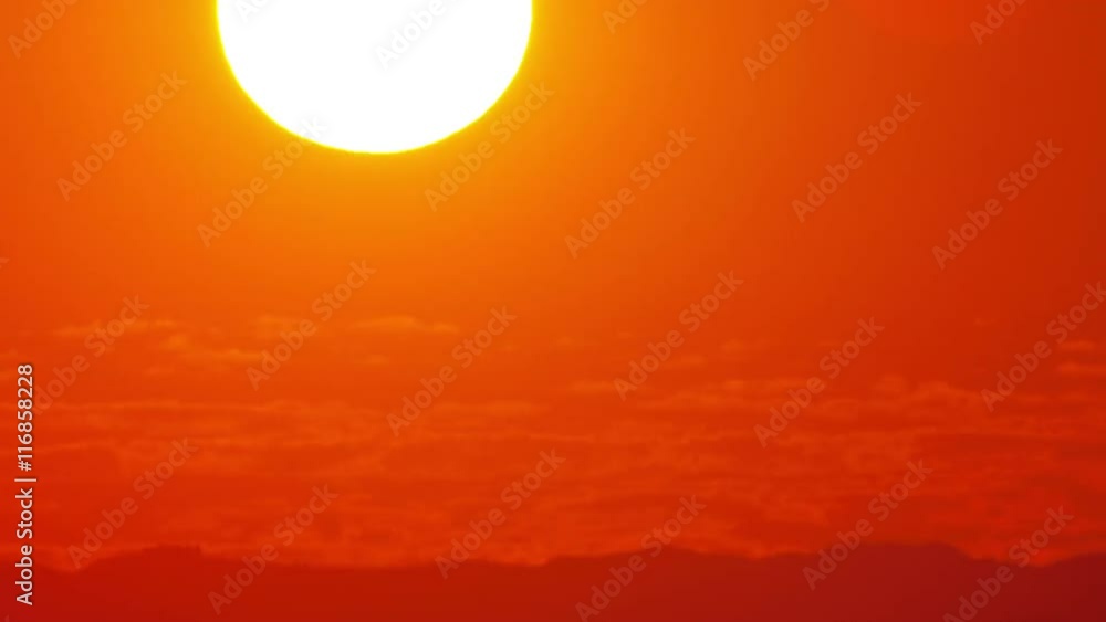 Beautiful time lapse of the sun setting behind the clouds. Beautiful time lapse of the sun setting behind the clouds.