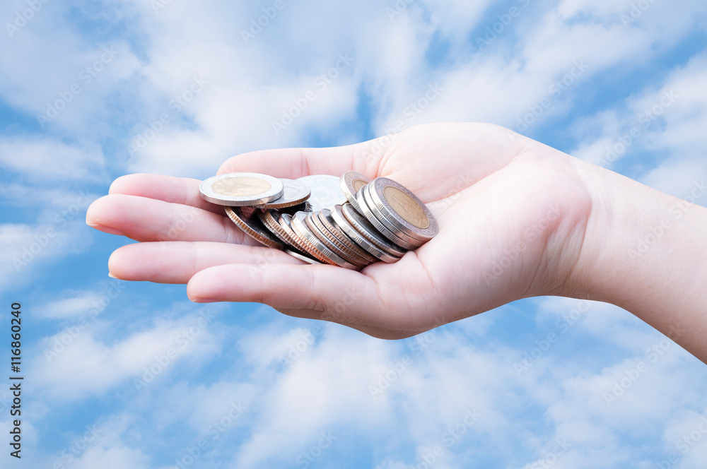 Coins in hands on blue sky,Donation Investment Fund Financial Support Charity  Dividend Market Growth Home House Stock Trust Wealthy Giving Planned Accounting Collection Debt Banking ROI concept