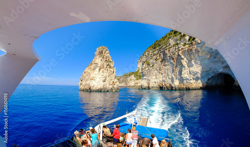 Paxos and Antipaxos island cliff as seen from a daily cruise boa photo