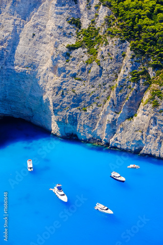 Boats anchored at sea in Greece near Zakynthos Island, Navagio B photo