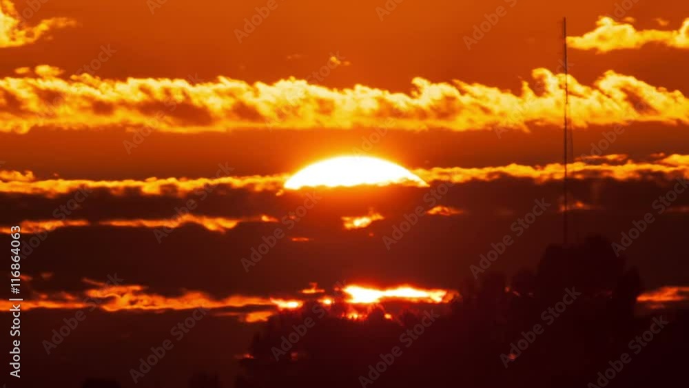 Time Lapse of the sun rising behind clouds. Time Lapse of the sun rising behind clouds.