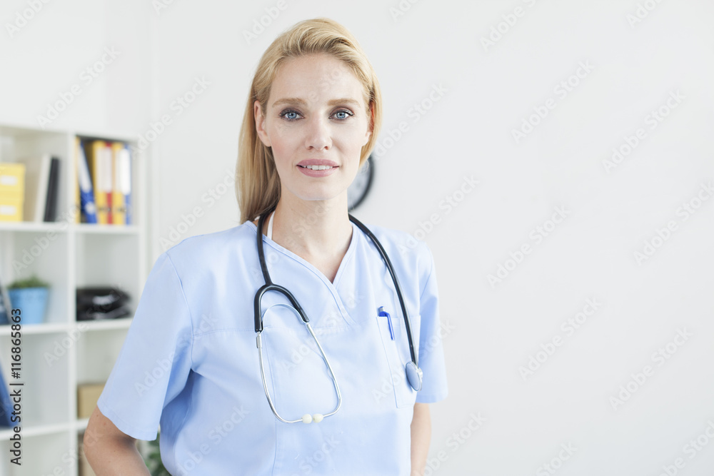 Young female doctor and practitioner working at desk
Young female doctor and practitioner working at desk