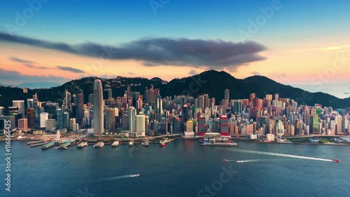 Sunset over Hong Kong island time lapse. Urban cityscape 4K panorama background photo
