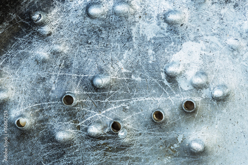 Canvas Print Holes from buckshot on metal surface