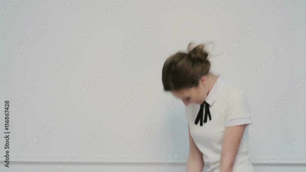 Girl dancing with a folder in hands Girl dancing with a folder in hands