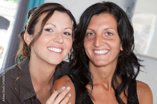 Lovely lesbian or friends couple smiling at the camera
