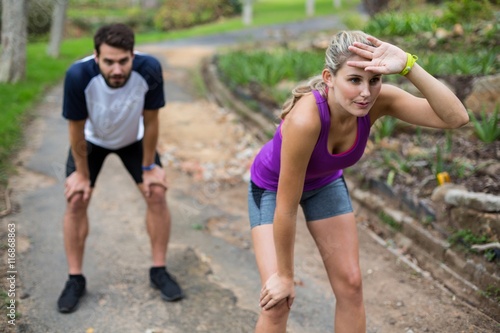 Couple feeling exhausted after jogging