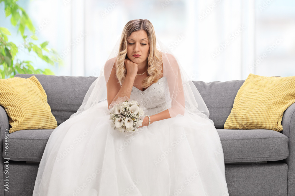 Depressed bride sitting on a sofa Depressed bride sitting on a sofa