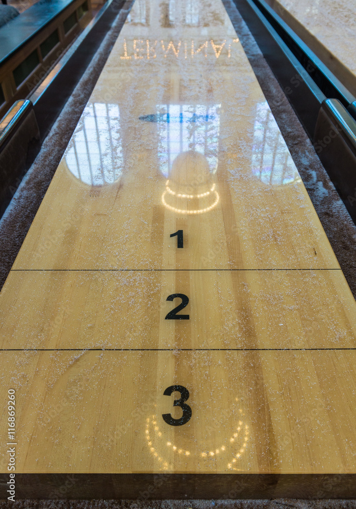 Historic wooden shuffleboard table in the renovated historic terminal