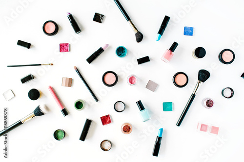 flat lay female cosmetics collage with lipstick, brush on white background. top view set
