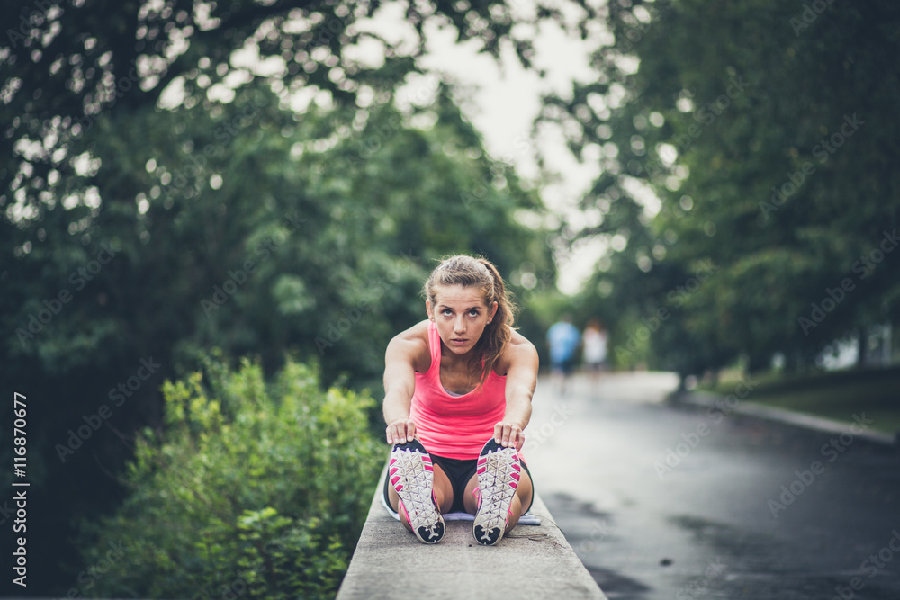 Fitness girl exercising and stretching outdoor Fitness girl exercising and stretching outdoor